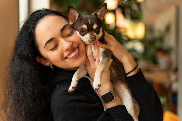 Adorable chihuahua dog with female owner