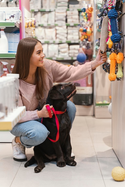 Adorable dog with owner at the pet shop