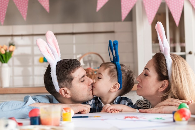 Free Photo adorable family with bunny ears celebrating easter