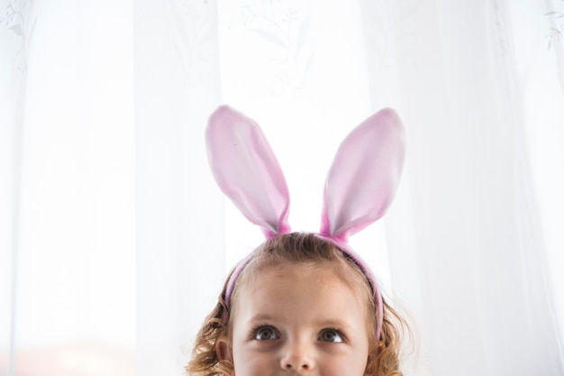 Free photo adorable girl in decorative bunny eart