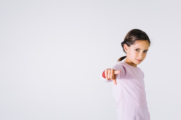 Free Photo adorable girl pointing at camera