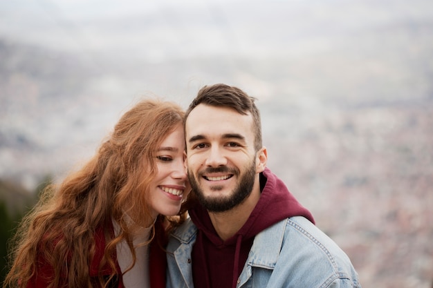 Adorable happy couple posing outdoors