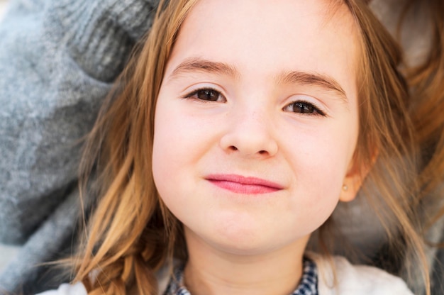 Adorable innocent girl close up portrait