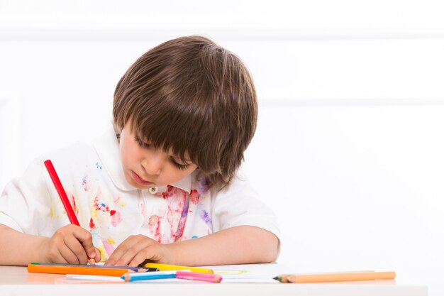 Adorable kid by the table