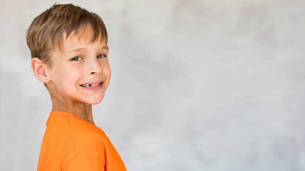 Adorable kid smiling with copy space