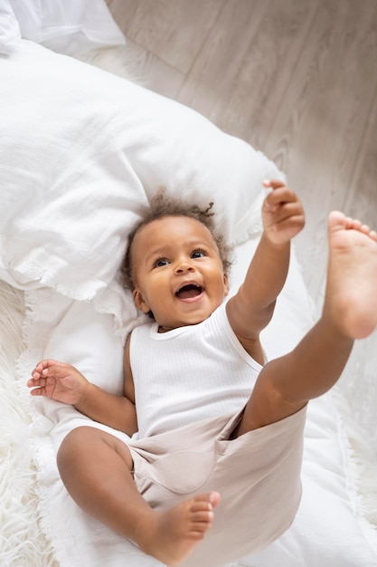 Free Photo adorable little black baby girl at home