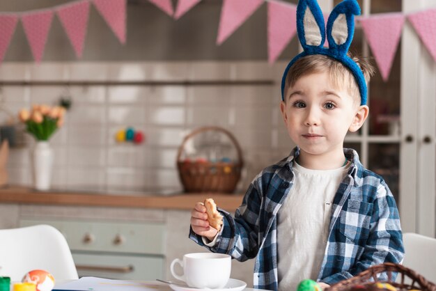 Adorable little boy with bunny ears posing