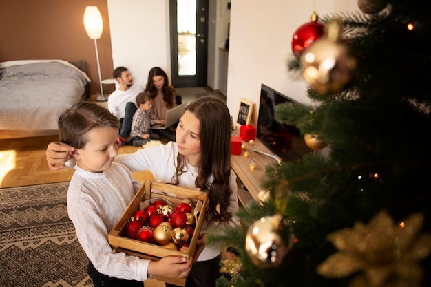 Adorable little boy with his sister on christmas