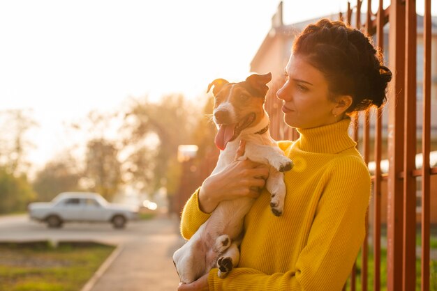 Adorable little dog with his owner