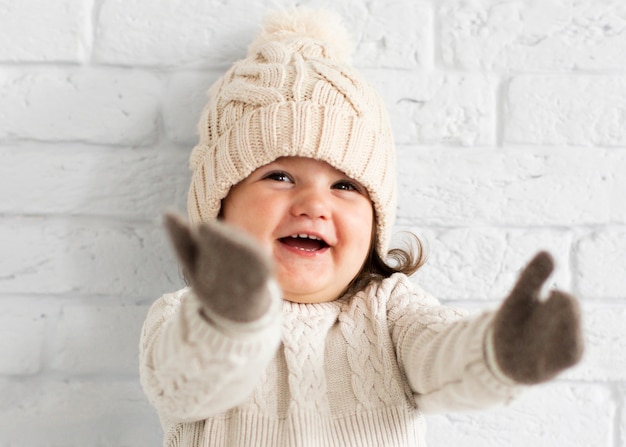 Free Photo adorable little girl raising her hands