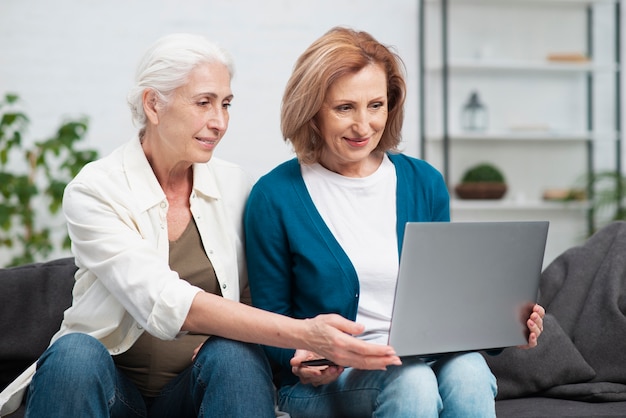 Adorable mature women using a laptop