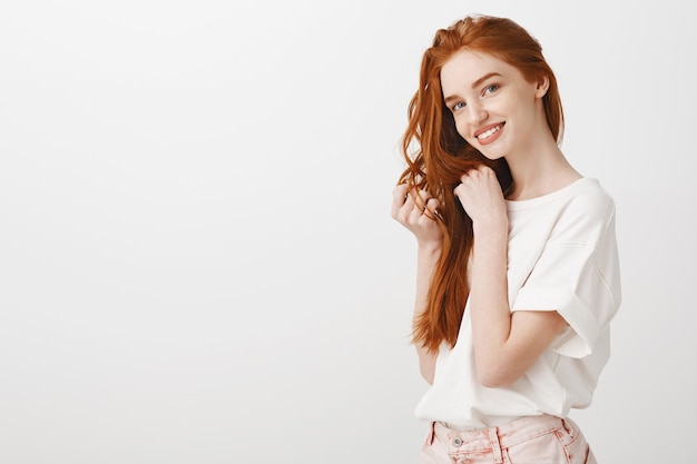 Adorable redhead woman looking tender and smiling