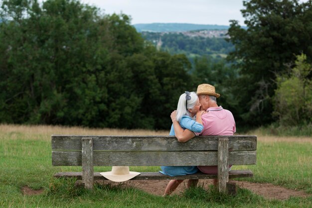 Adorable senior couple sitting on a bench