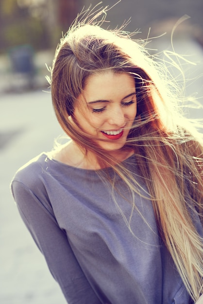 Free photo adorable teen laughing with closed eyes