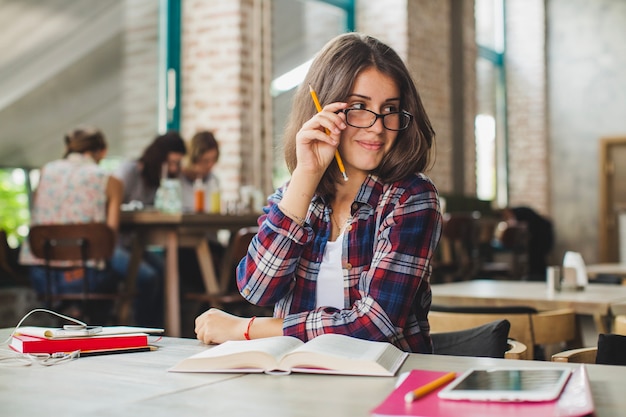 Adorable teen posing while studying