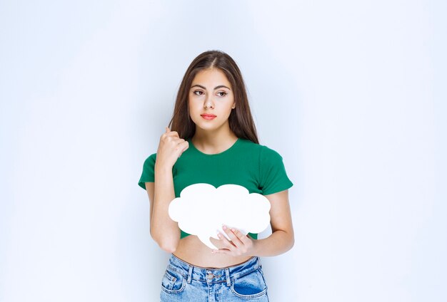 Adorable woman holding speech bubble banner on a white background .