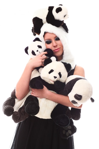 Free Photo adorable woman with lots of stuffed pandas