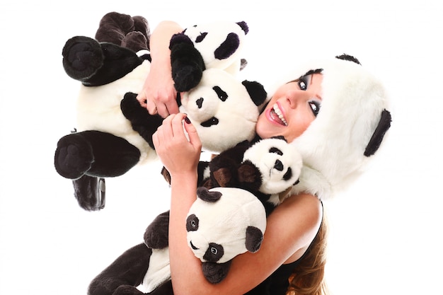 Free Photo adorable woman with lots of stuffed pandas