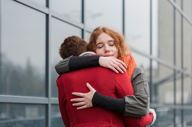 Adorable women hugging with passion