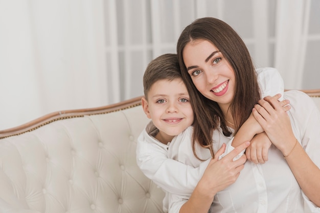 Adorable young boy holding his mom