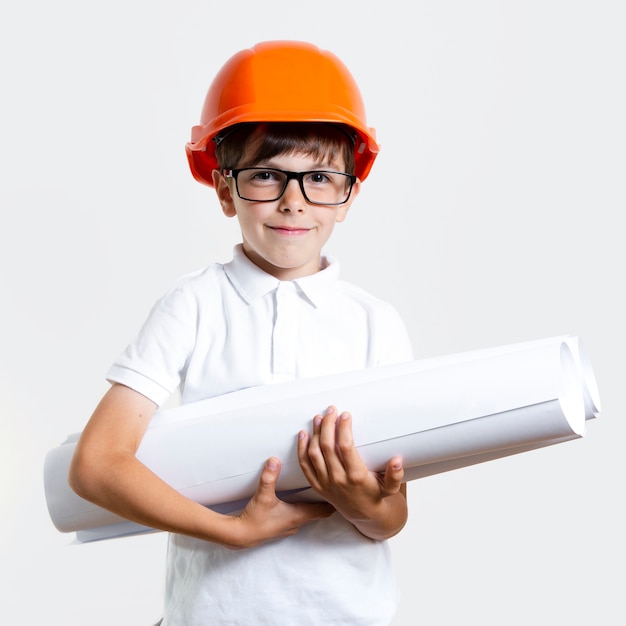 Free photo adorable young boy with glasses and helmet