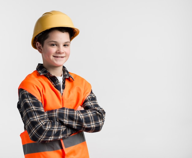 Free photo adorable young boy with hard hat on