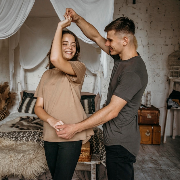 Adorable young couple dancing together