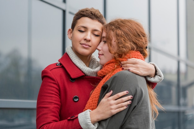 Free Photo adorable young women together in love