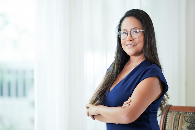 Adult confident businesswoman with arms crossed