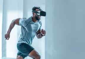 Free photo adult doing fitness through virtual reality