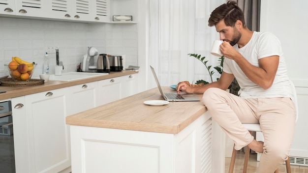 Free photo adult male casually working from home