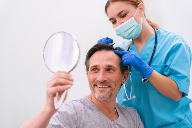 Adult male getting a hair loss treatment