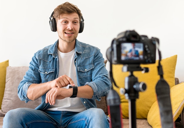 Free photo adult male recording with headphones on