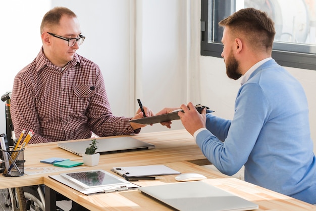 Adult males working together at the office