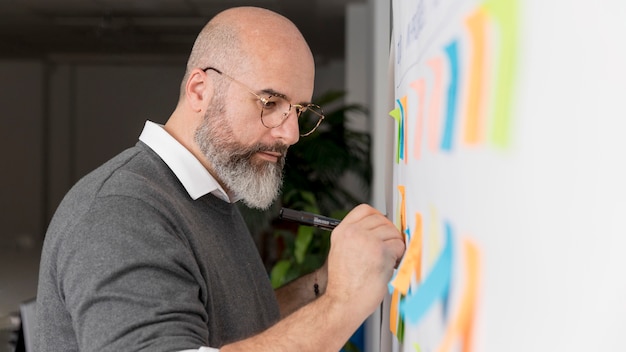 Free photo adult man preparing business plan