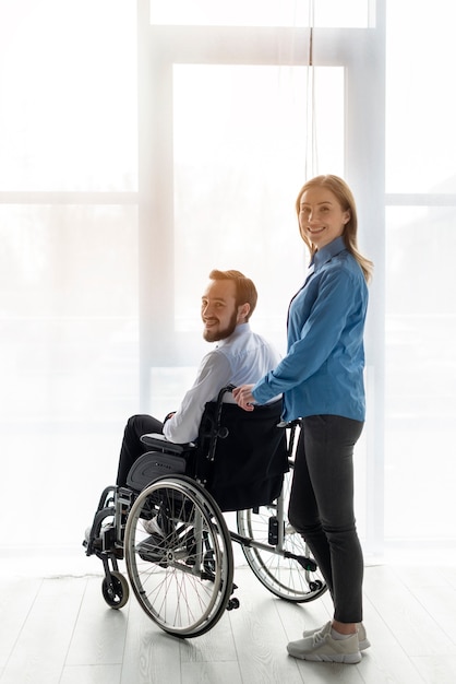 Adult man and woman posing together