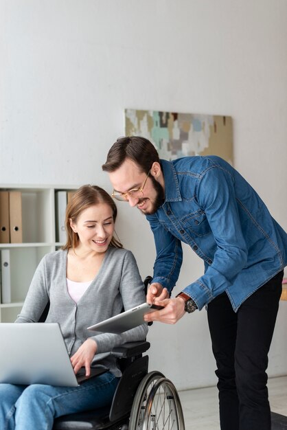 Adult man and woman working together at the office