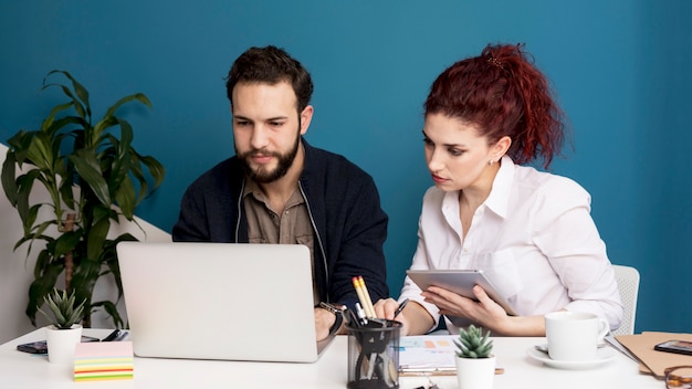 Adult man and woman working together