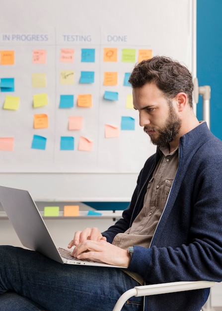 Adult man working on laptop