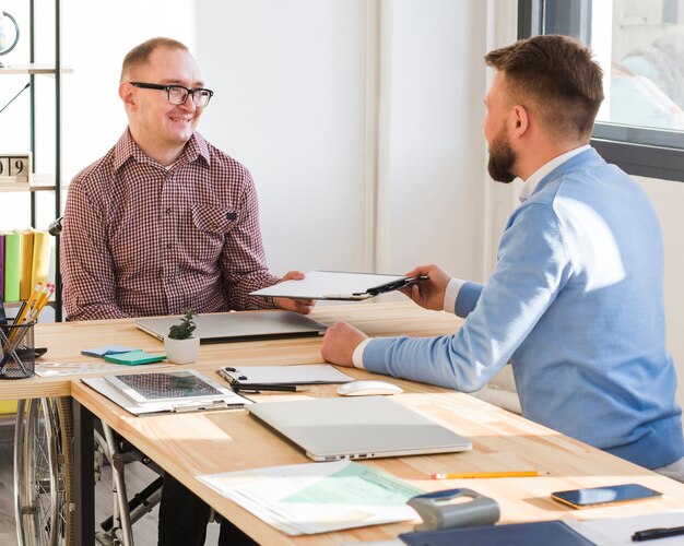 Adult men working together at the office