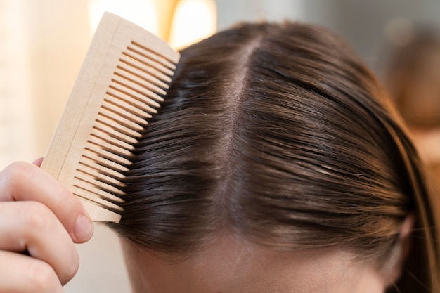 Adult taking care of their hair