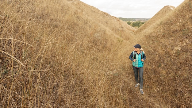 Free photo adult traveler hiking on a path