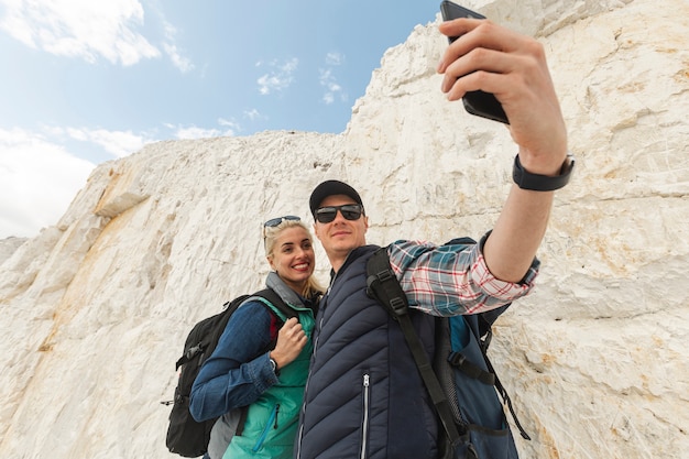 Adult travelers taking a selfie