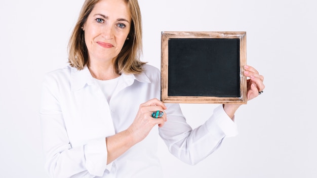 Adult woman demonstrating blackboard