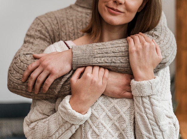 Free photo adult woman hugging her husband