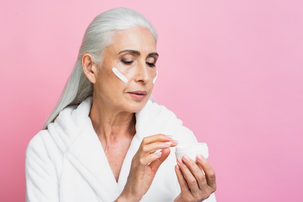 Adult woman testing moisture cream