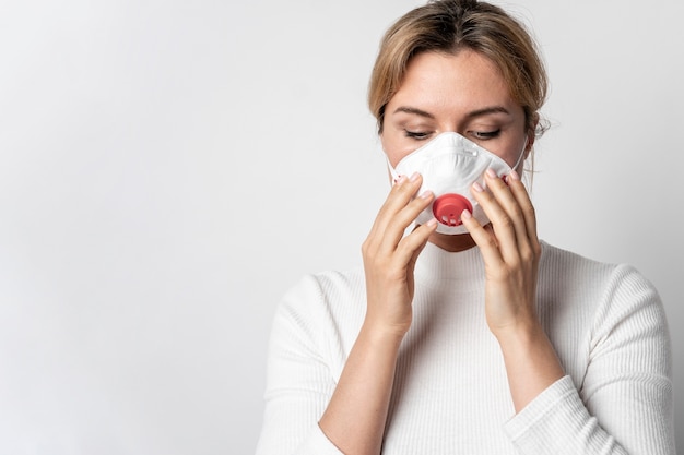 Adult woman wearing surgical mask for protection