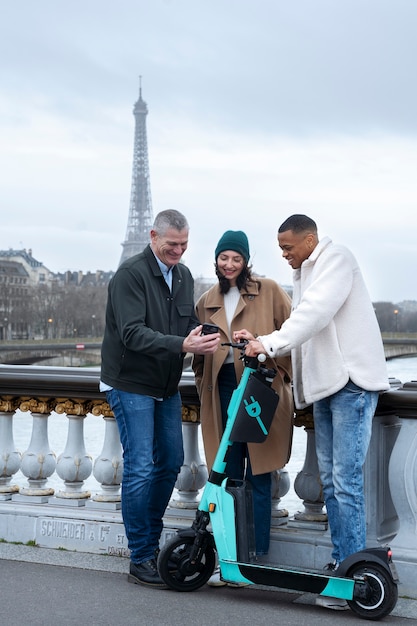 Free Photo adults learning to use electric scooter