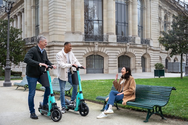 Free Photo adults learning to use electric scooter