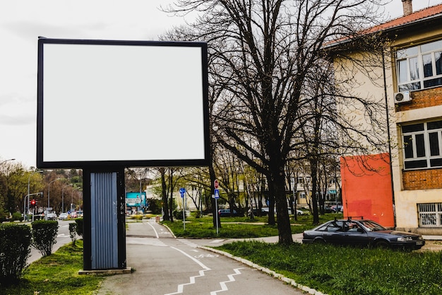 Free Photo advertisement billboard in front of apartment building in the city